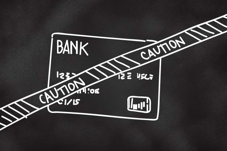 A drawing of a credit card with a strip of Caution tape over the front of it.